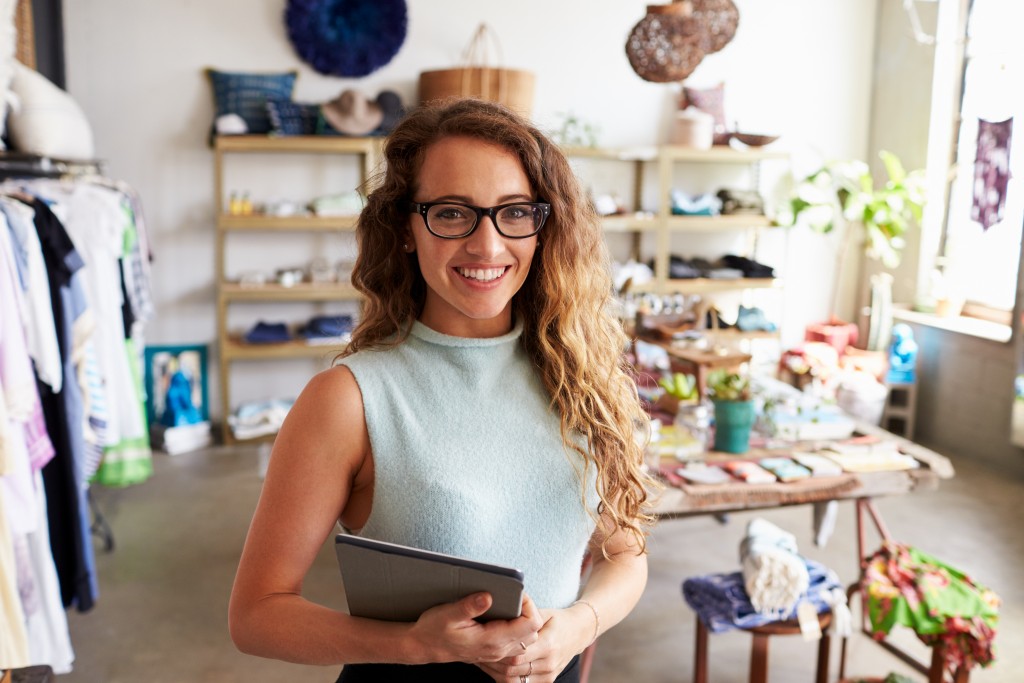 Business owner posing in her store
