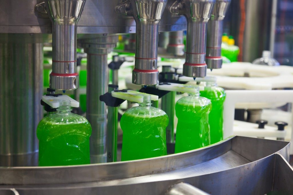 bottles being filled with liquid