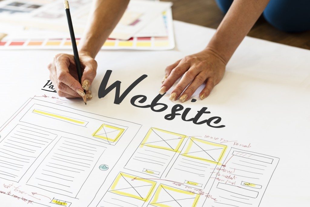 woman designing a website layout