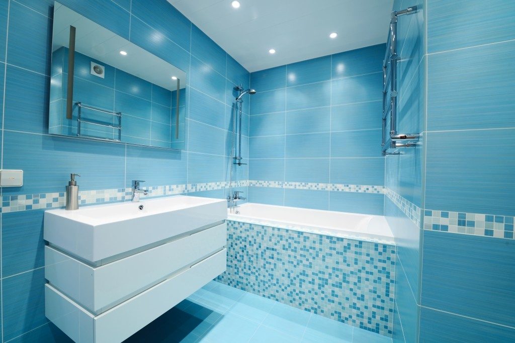 Modern luxury bathroom in blue interior