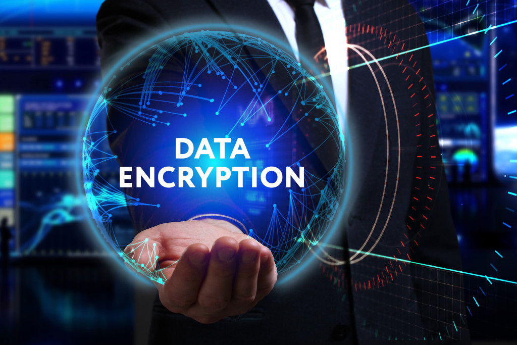 data encryption logo being held by a businessman